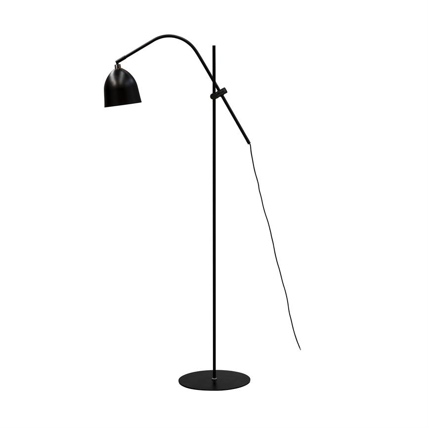 Black floor lamp with round shade, curved arm and flexible adjustment rod; power cord hangs down from the arm. The lamp stands on a tall, slender pole with a circular base on a white background.