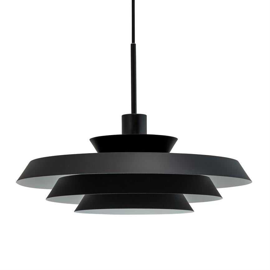 Black, matt layered pendant lamp hangs from thin wire; disc-shaped metal screens with white interior stacked in three-part design, on white studio background.