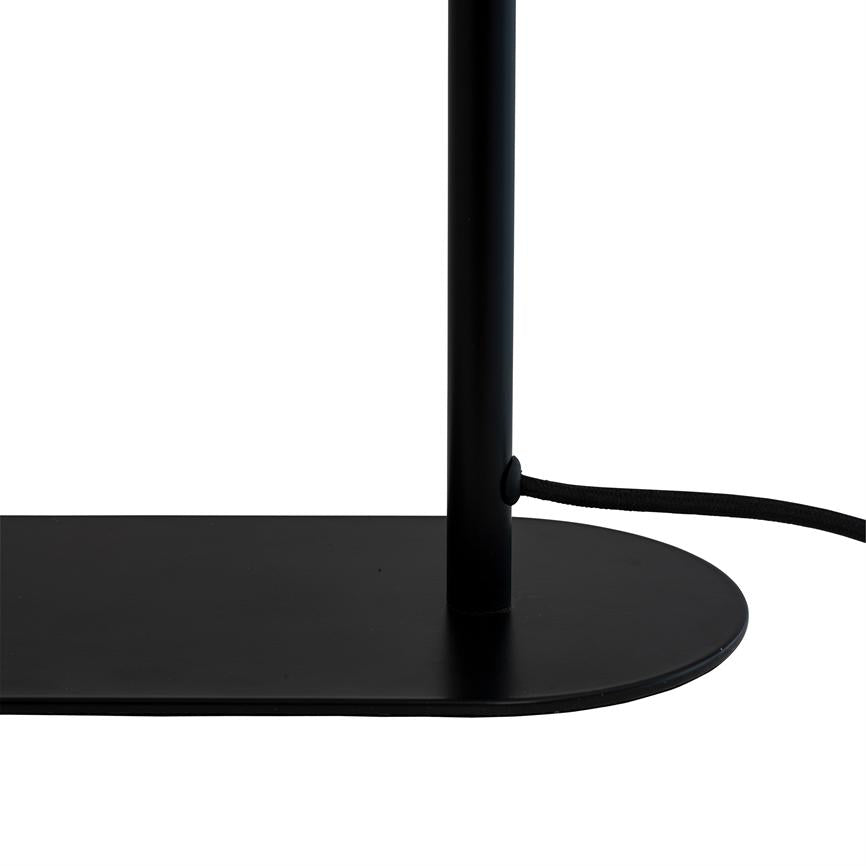 Black lamp post is mounted on an oval black base and leads a textile-covered power cable out through a side hole on a white background.
