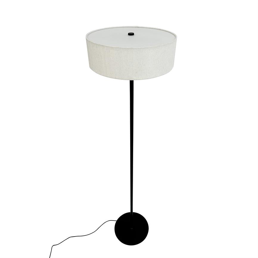 Floor lamp stands upright with a wide, round white shade; thin black post and round black foot with visible wire on a white background.