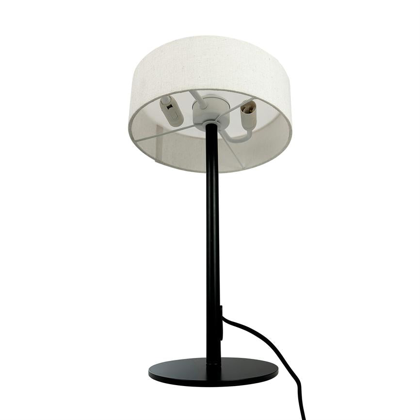 Table lamp on round black base; a black rod carries a white textile shade showing two empty bulb sockets and internal fitting; a black wire runs from the base.