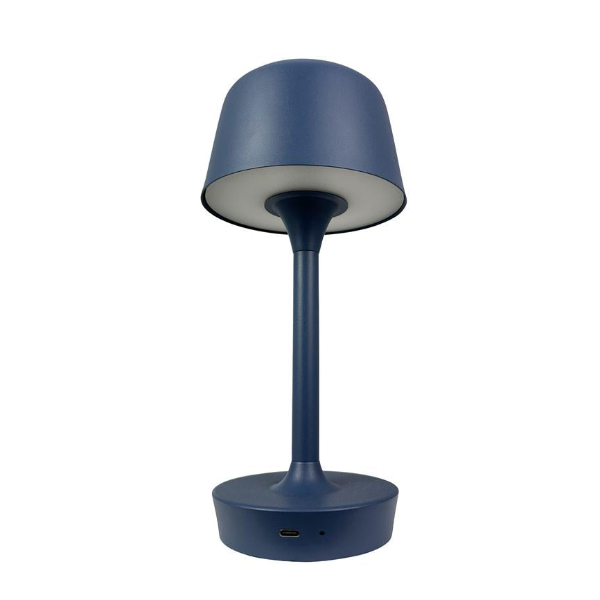 Table lamp in matte dark blue, raised shade casts light downwards, slim center piece and round base with USB-C port, pictured against neutral white background.