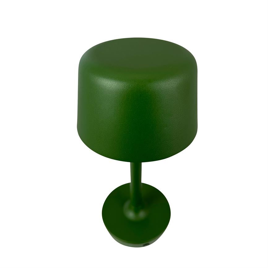 Green table lamp with rounded cylindrical shade stands upright; a slim shaft connects the screen to a round base on a plain white background.