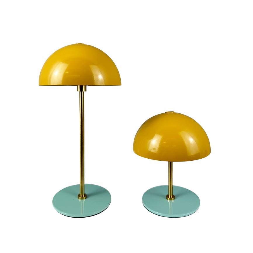 Two yellow dome lamps stand side by side on a white background; both have brass rod and turquoise round foot; one is tall with a long shaft, the other is short.
