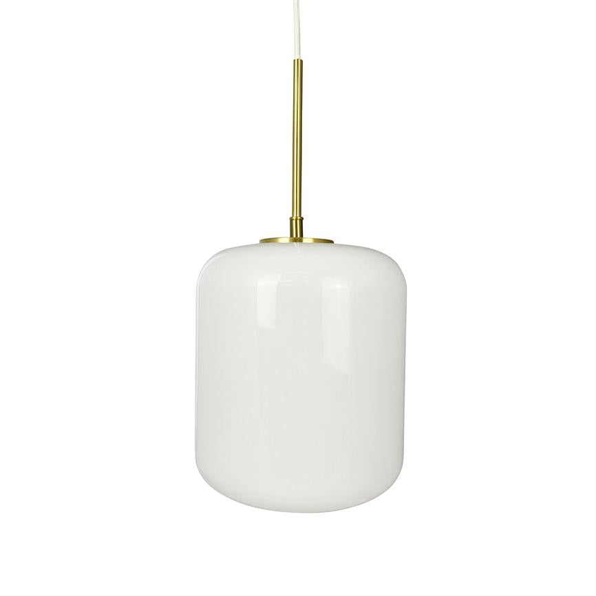 White, smooth and rounded cylindrical pendant lamp hangs from a slender brass rod with white cord; the lamp is muted and shown against a simple, neutral white background.