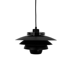 Black, layered pendant lamp hangs from a black cord in front of a plain white background, characterized by flat, circular shades stacked in decreasing sizes.