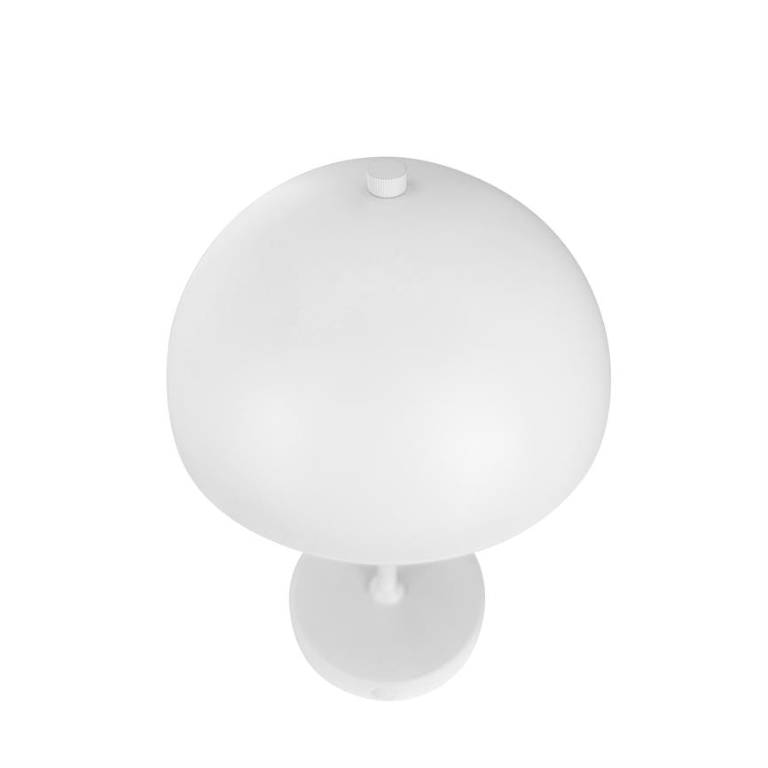 White table lamp with round, mushroom-shaped shade and small knob on top; rests on a slender foot against a uniform white, studio-like background, seen from above.