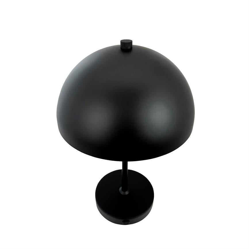 Black table lamp stands on a round base, with a hemispherical shade and a small round knob on top; slim rod-shaped stand and matte black surface against a white background.