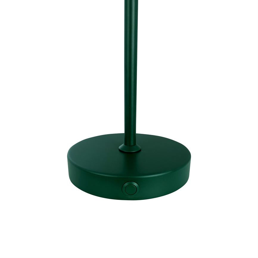 Green lamp base stands upright; a slim rod is fixed in the center of a round base with a built-in push button on the front. White, neutral background.