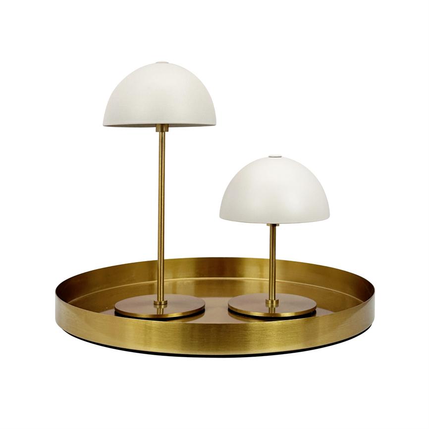 Two white dome lamps stand at different heights on a round, brushed brass tray; thin brass stems and round bases, isolated against a uniform white background.