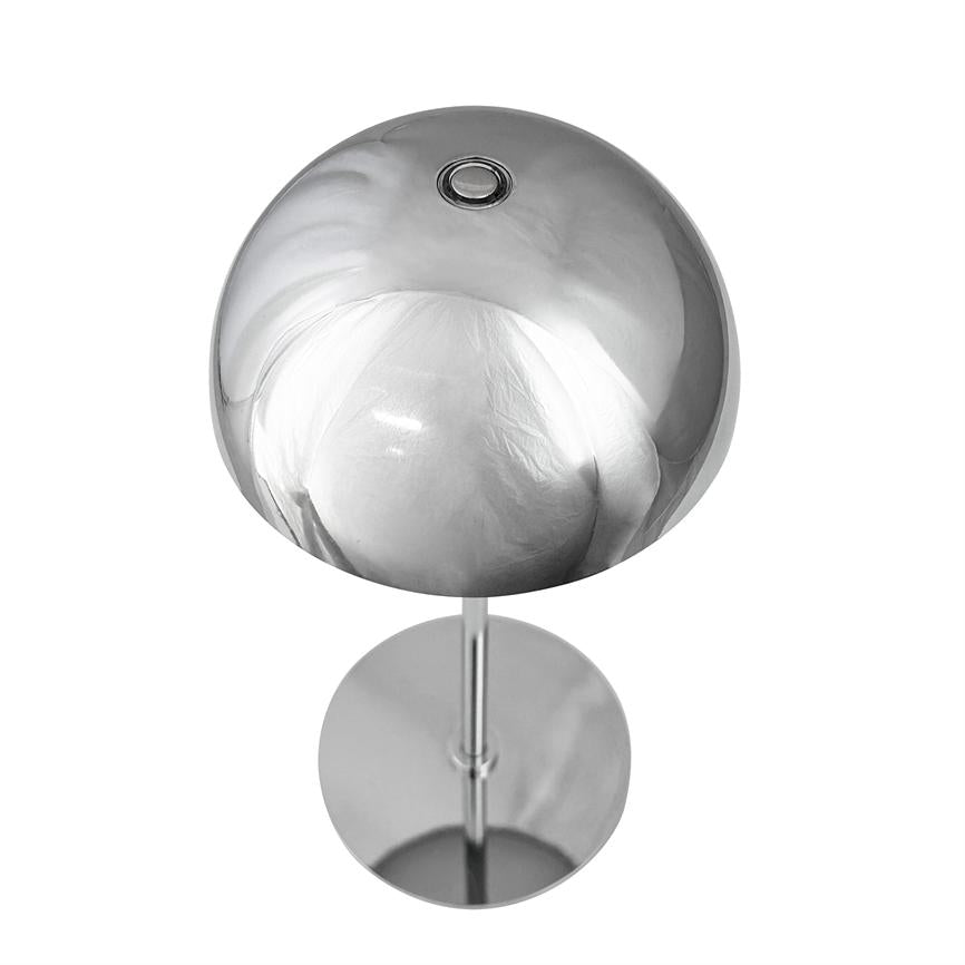 Chrome table lamp with round, mirror-gloss dome and small circular opening at the top; the dome stands on a thin pole and round base, reflecting a neutral white background.