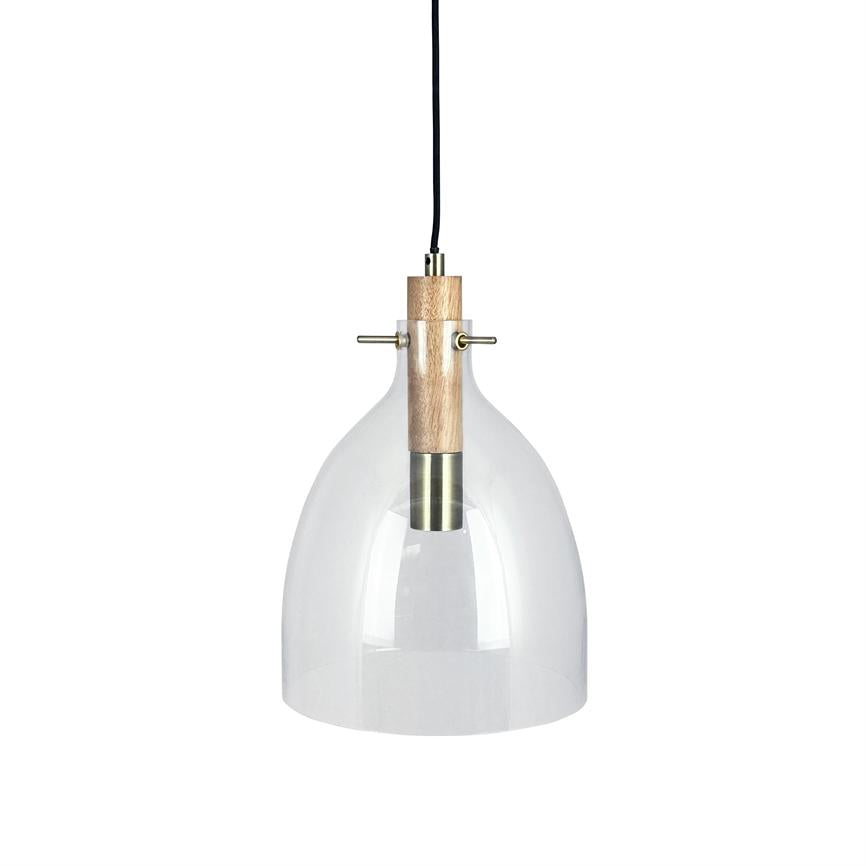 Hanging lamp with clear glass dome and wood and brass details hangs on a black cord over a neutral white studio background.