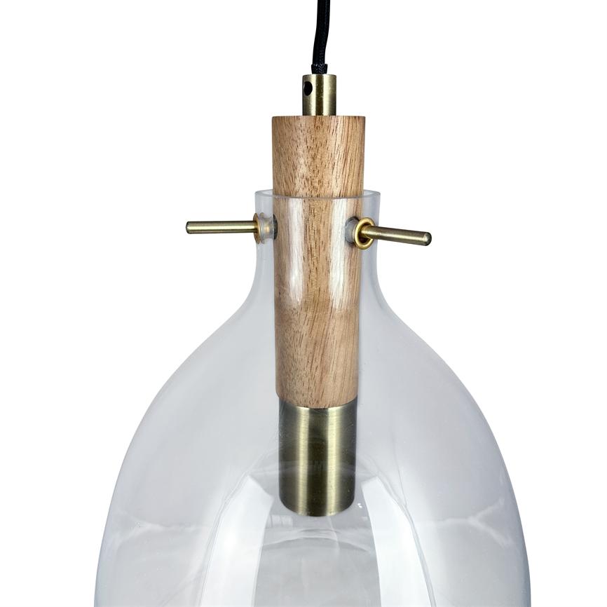 Pendant lamp with clear, rounded glass shade, wooden top and brass fittings with two transverse rods; hanging by black wire in front of a white background.