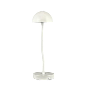 A white table lamp with a dome-shaped shade stands on a round base; slender, slightly bent shaft in the centre, against a uniform white background.