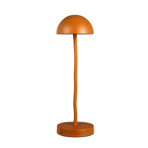 An orange table lamp: hemispherical shade raised on a slender, slightly bent rod, mounted on a round base; stands isolated on a uniform white background.