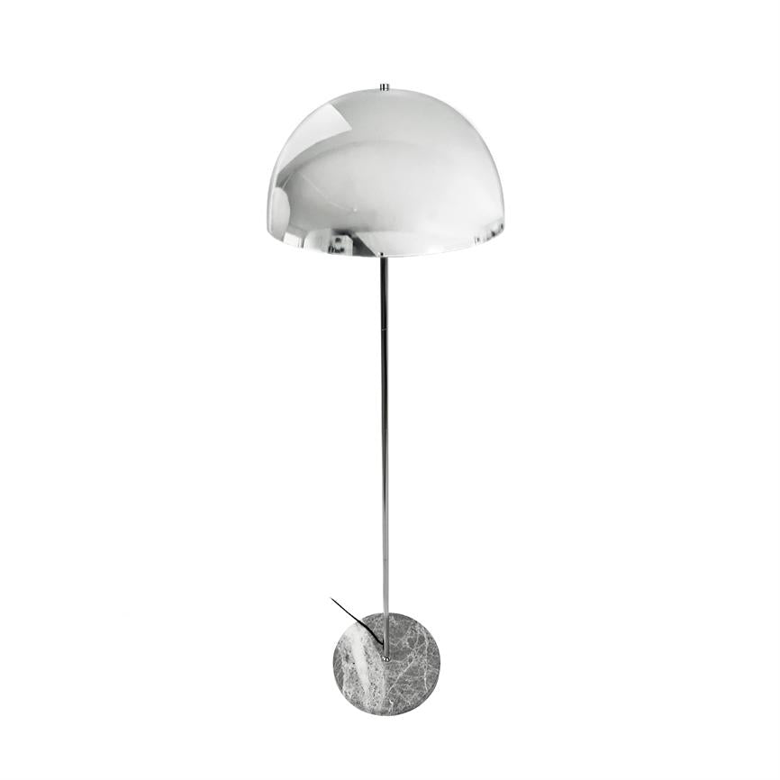 A tall, modern floor lamp stands upright; chrome hemispherical shade, slim metal rod and round marble base on a white, minimalist background.