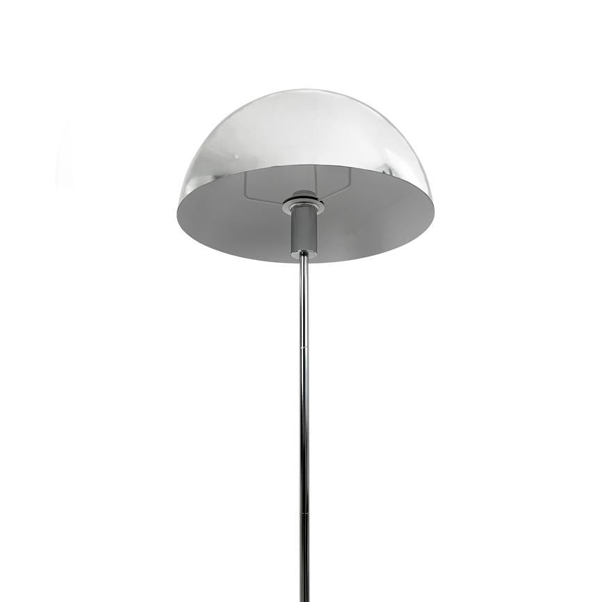 Chrome hemispherical floor lamp mounted on a slim, vertical rod; the screen faces downwards and suggests directional lighting. Isolated against a solid white background.
