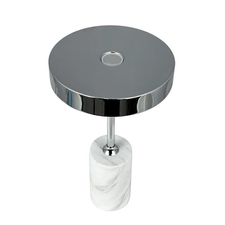 Round chrome top rests on a slim chrome shaft which is connected to a cylindrical white marble base on a pure white background.