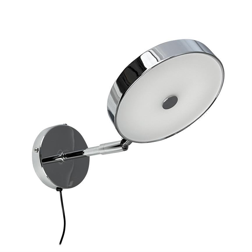 Wall lamp mounted on a round metal plate, with a hinged arm and a round, adjustable shade facing forward; chrome finish, white diffuser and black wire hanging down.