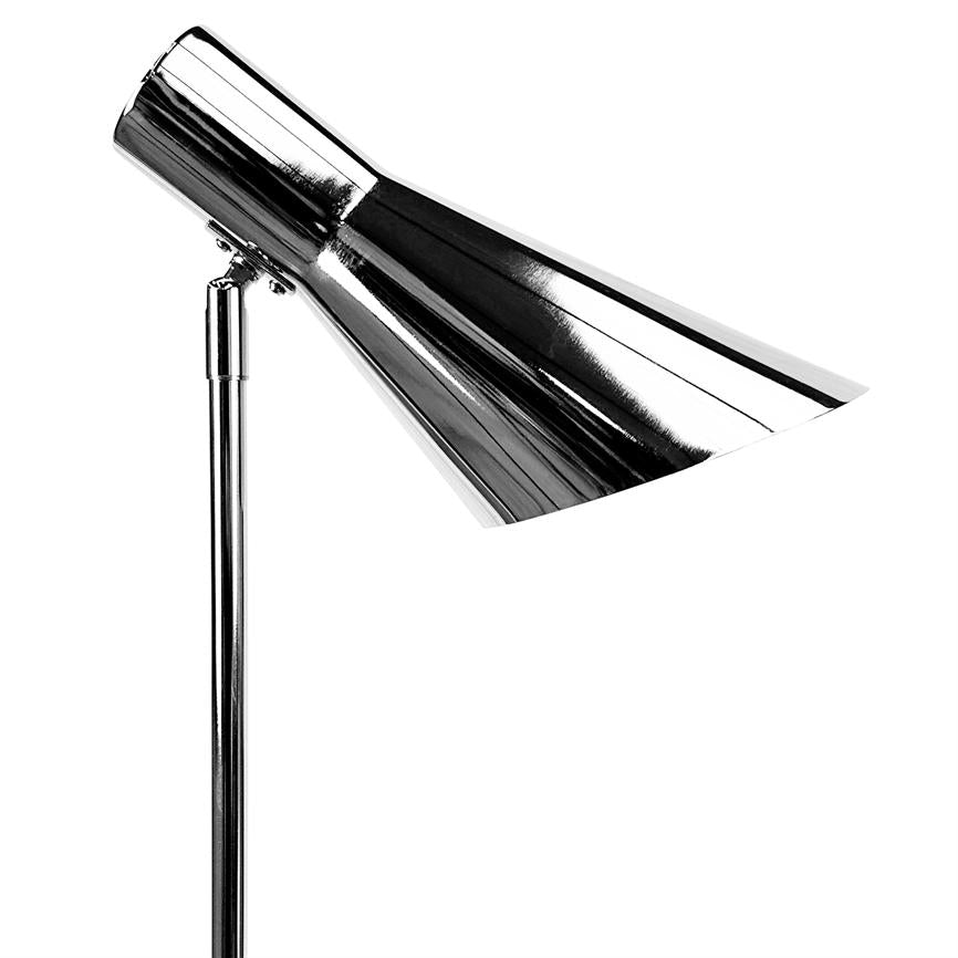Chrome lamp head angled obliquely downwards, mounted on a slender metal rod; the lamp points towards the substrate in front of a uniform white background.