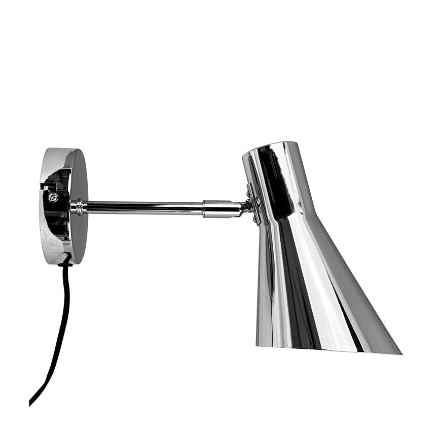 Wall lamp: chrome-plated arm extends from a round wall plate, holding an angled, glossy shade; cable hangs down — simple, modern installation against white background.