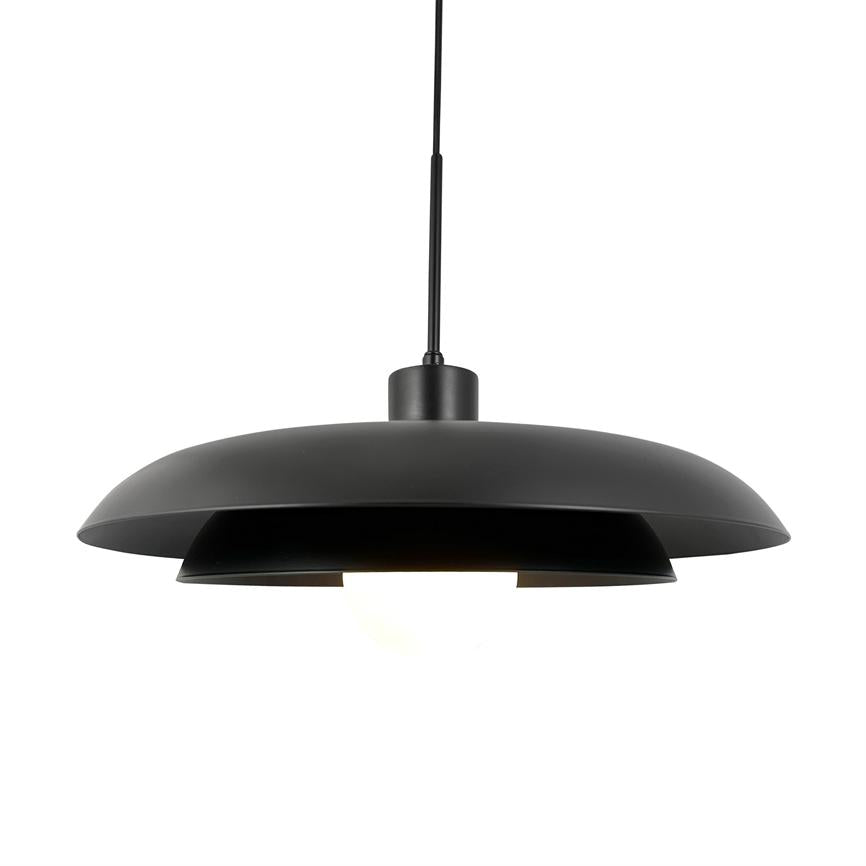 Black, round pendant lamp hangs from a black cable and emits soft, downward-directed light through two overlapping metal shades. Environment: neutral white background, modern and minimalistic.