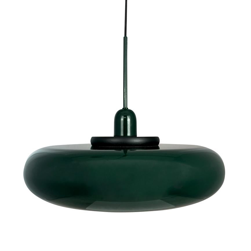 A dark green, shiny pendant lamp hangs from a thin black cord; round, donut-shaped glass shade with black socket against a uniform white background.