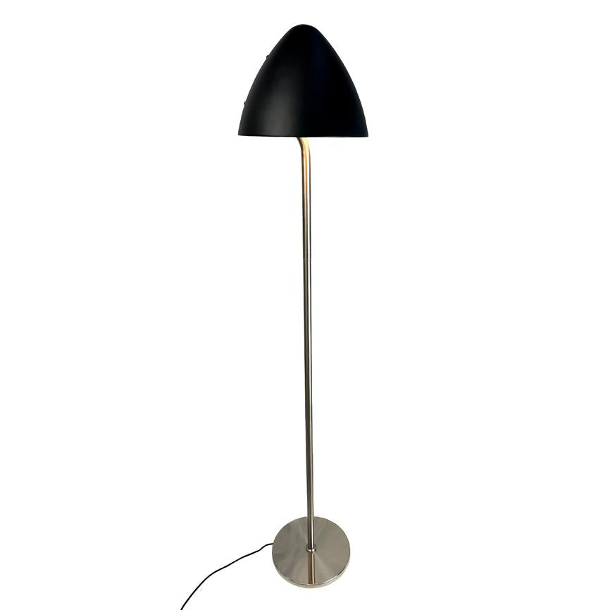Standing floor lamp with black dome-shaped shade, thin chrome rod and round metal base; a black cord extends from the foot against a uniform white background.