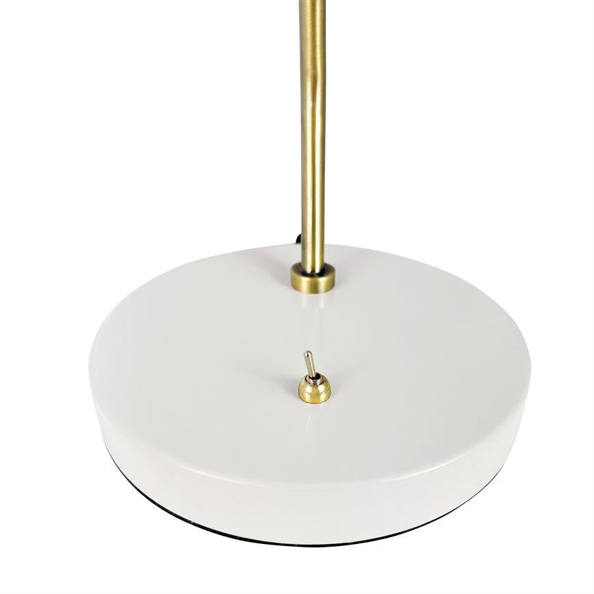 Lamp base with round white base, a small brass rocker switch sits on top; a slender brass rod is mounted centrally, surrounded by neutral white background.