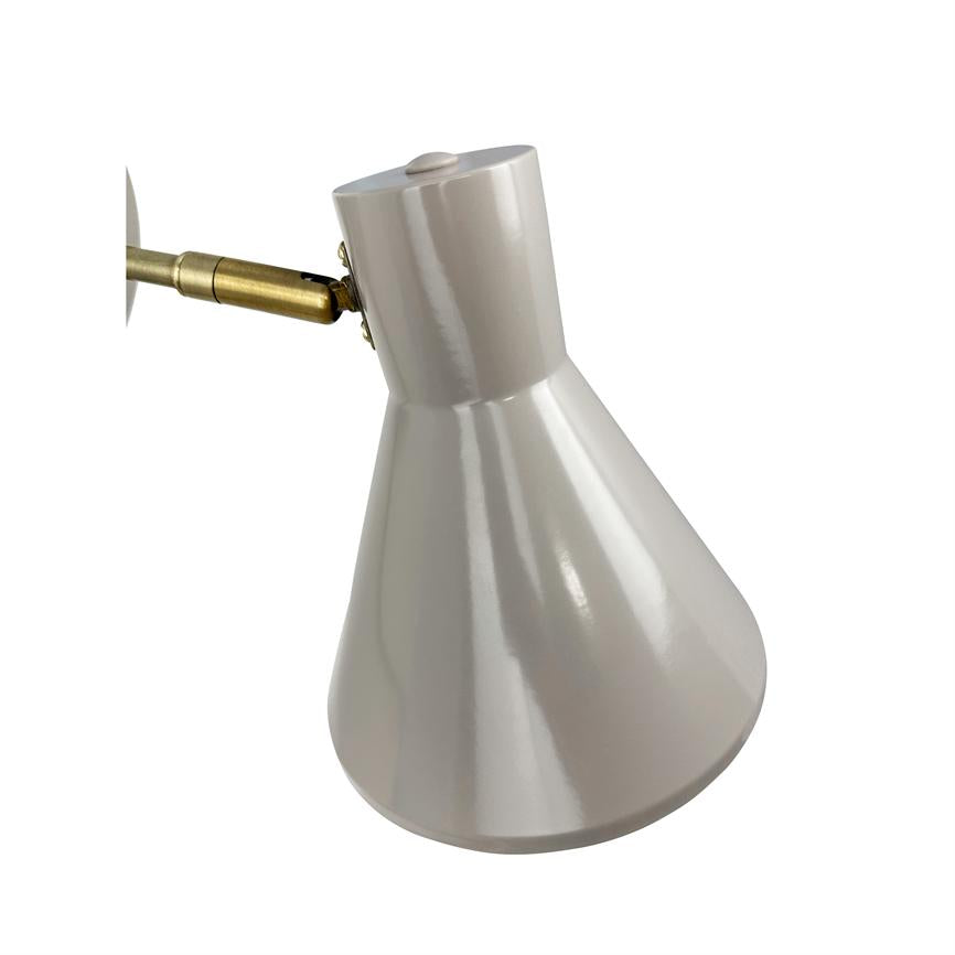 White glossy conical lampshade points downwards, mounted on a small brass joint and arm against a neutral white background.