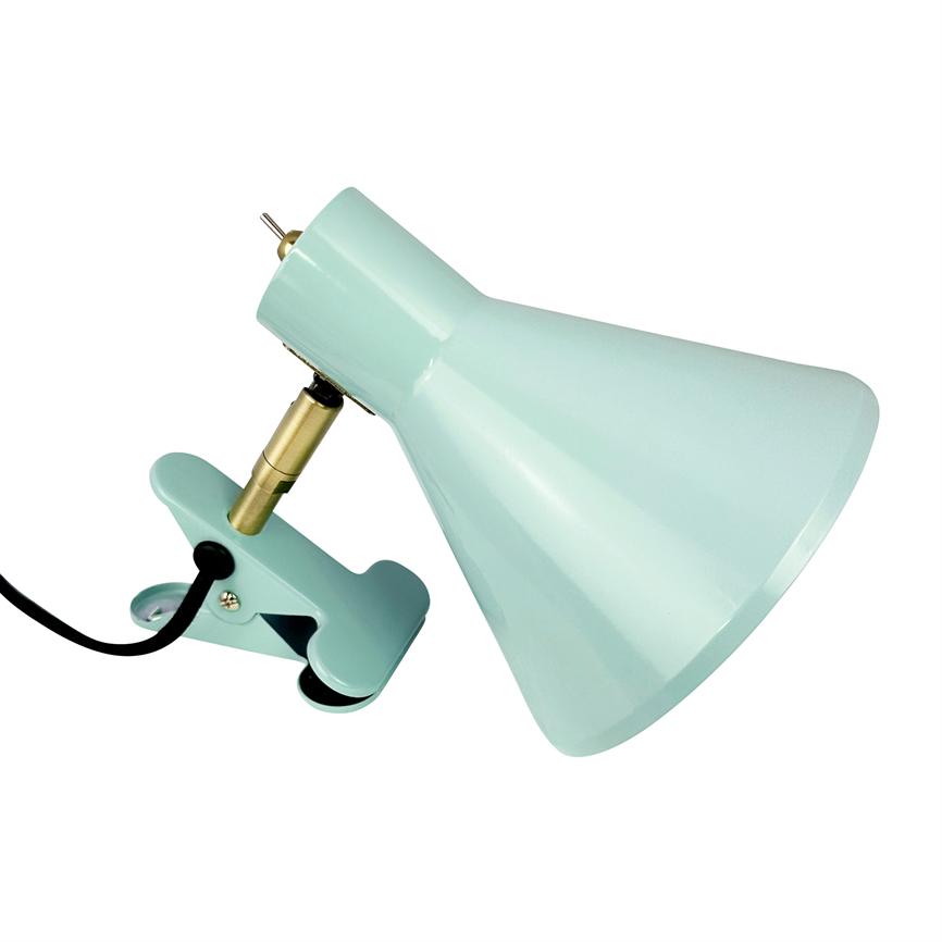 Mint green clamp table lamp mounted on a clamp, the shade angled downwards via a brass link; black wire is led away. Simple, white background.