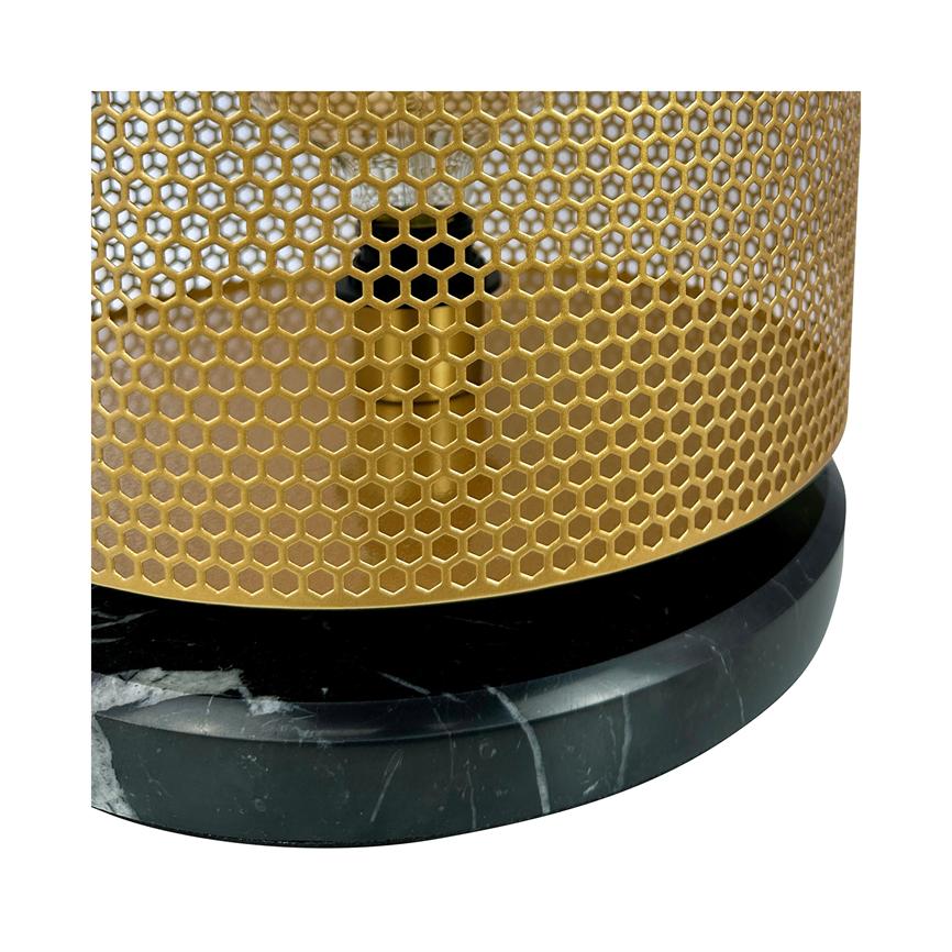 Gold-colored honeycomb patterned metal grille surrounds an inner cylinder and stands on a round black marble base.