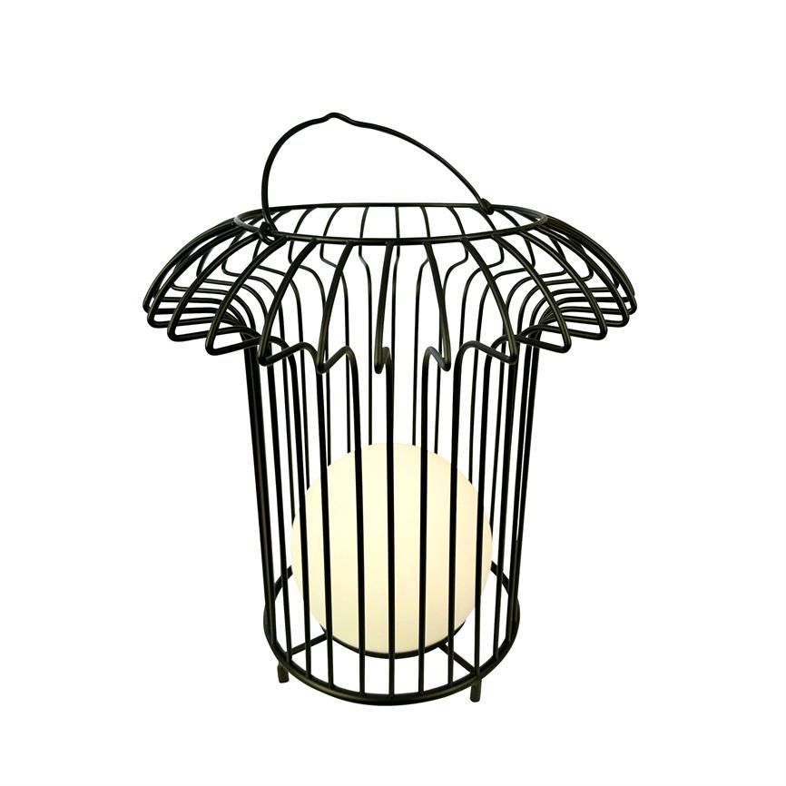 Black metal cage lantern encases a warm, glowing ball of light; it hangs/stands with curved handle and finely carved goblet-like top details, isolated against a uniform white background.