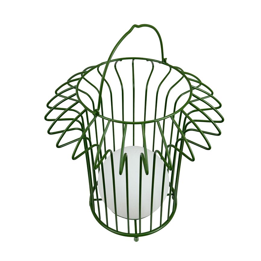Green metal wire basket with curved handle holds a white ball; the basket's vertical bars and floral outer rings encircle the sphere on a white background.