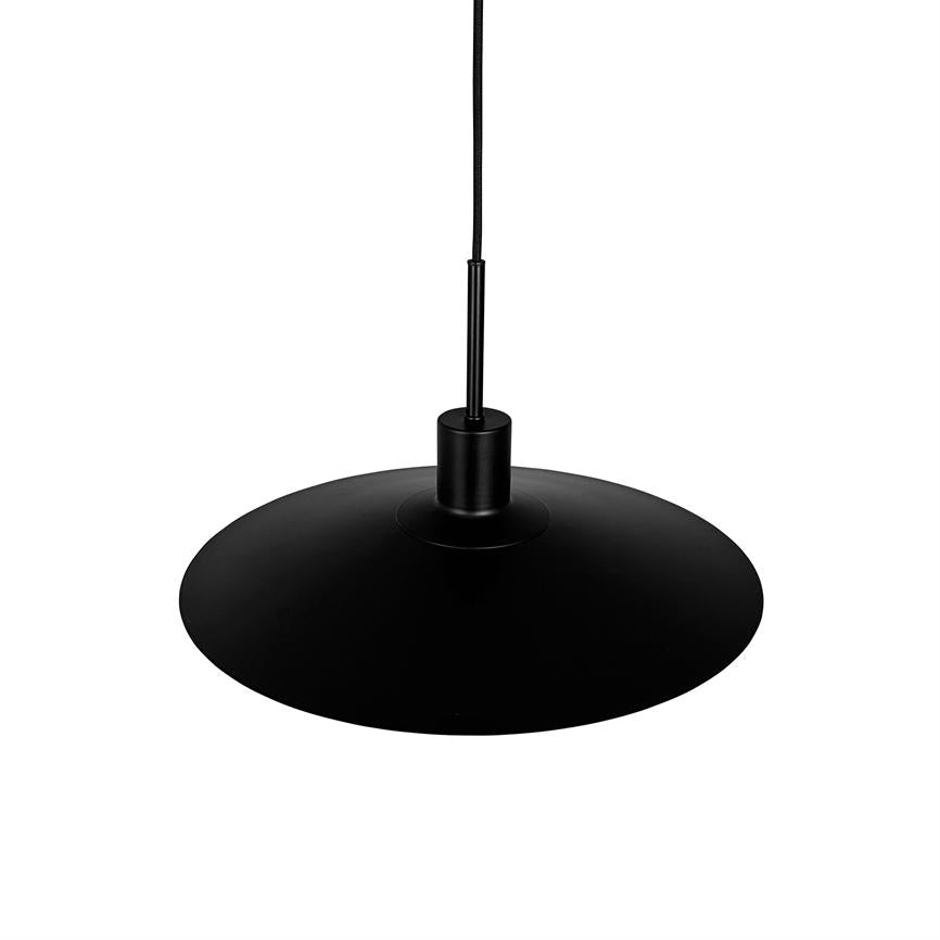 A black pendant lamp hangs from a thin cord; a flat, circular screen spreads wide, simple matte finish over a white background in a minimalist studio setup.