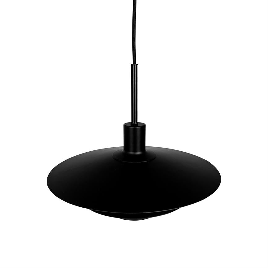 Black pendant lamp hangs from a thin textile cord, with wide, flat lampshade shaped like a disc; simple, matte surface and solid color against a white studio background.