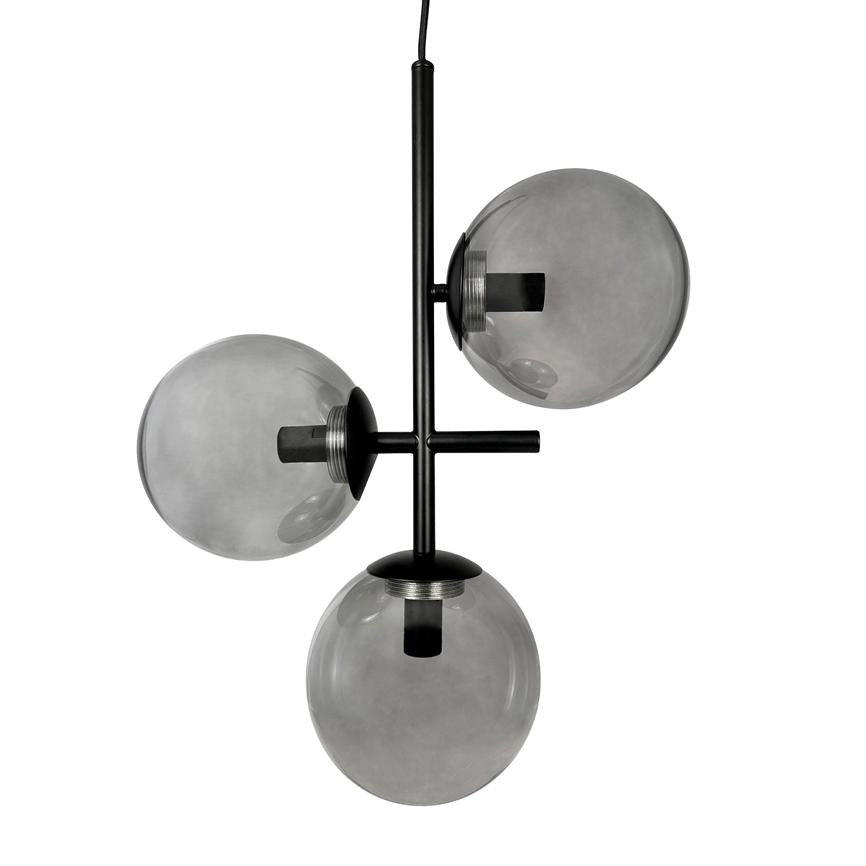 A modern ceiling pendant with three smoked glass domes, mounted on a black metal rod; the domes hang at different heights and reflect light against a neutral white background.