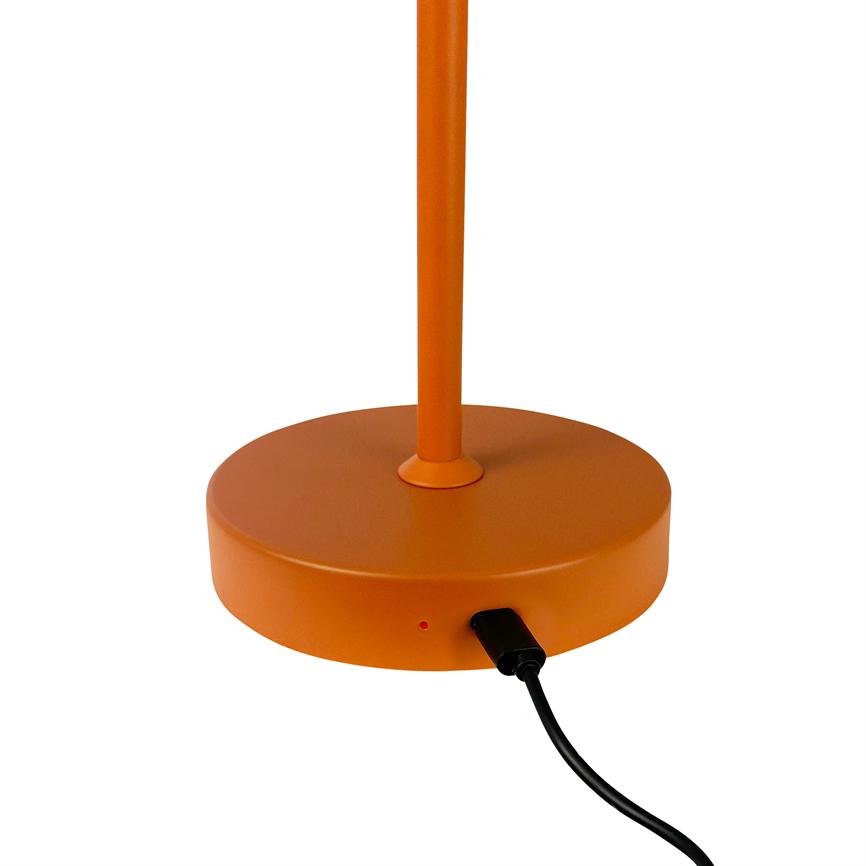 Orange lamp base with vertical rod; a black USB cable is plugged into the side, a small red LED lights up, placed on a uniform white background.