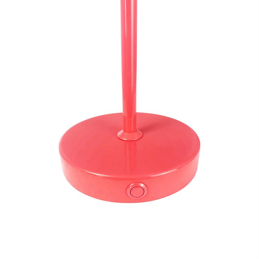 Round red lamp base; a slim red bar rises from the center, the front has a small circular power button. White neutral background.
