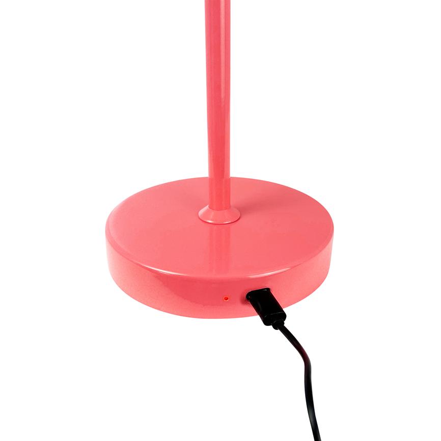 Pink round lamp base stands with a slender pole upwards and is connected to a black USB cable; simple white studio background.