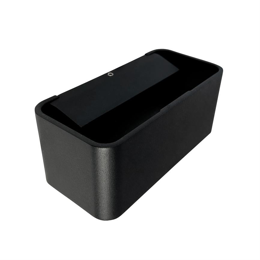 Black, rectangular case with rounded corners; a narrow black gate lies partly open over an inner opening; presented against a uniform white background.