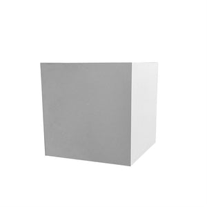 A grey-white cube stands isolated on a white background; the front surface is gray, the right side is lighter, and a faint shadow suggests soft light and three-dimensional form.