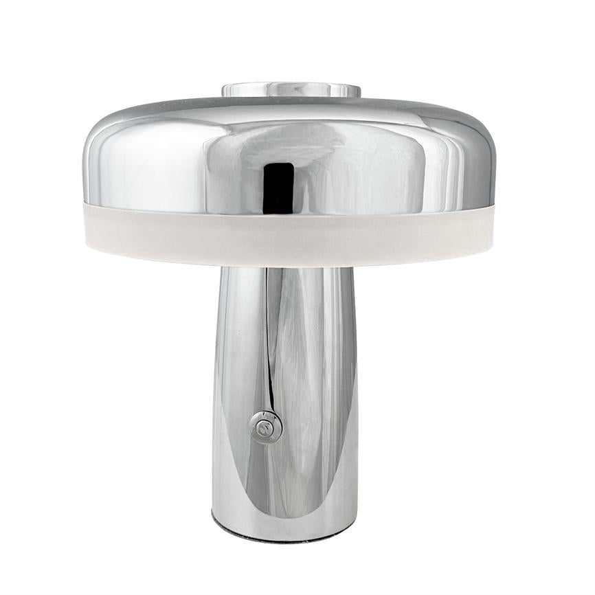 Table lamp in polished chrome, mushroom-shaped shade with white diffuser ring; it stands on a smooth cylindrical base with power button at the front, set against a neutral white background.