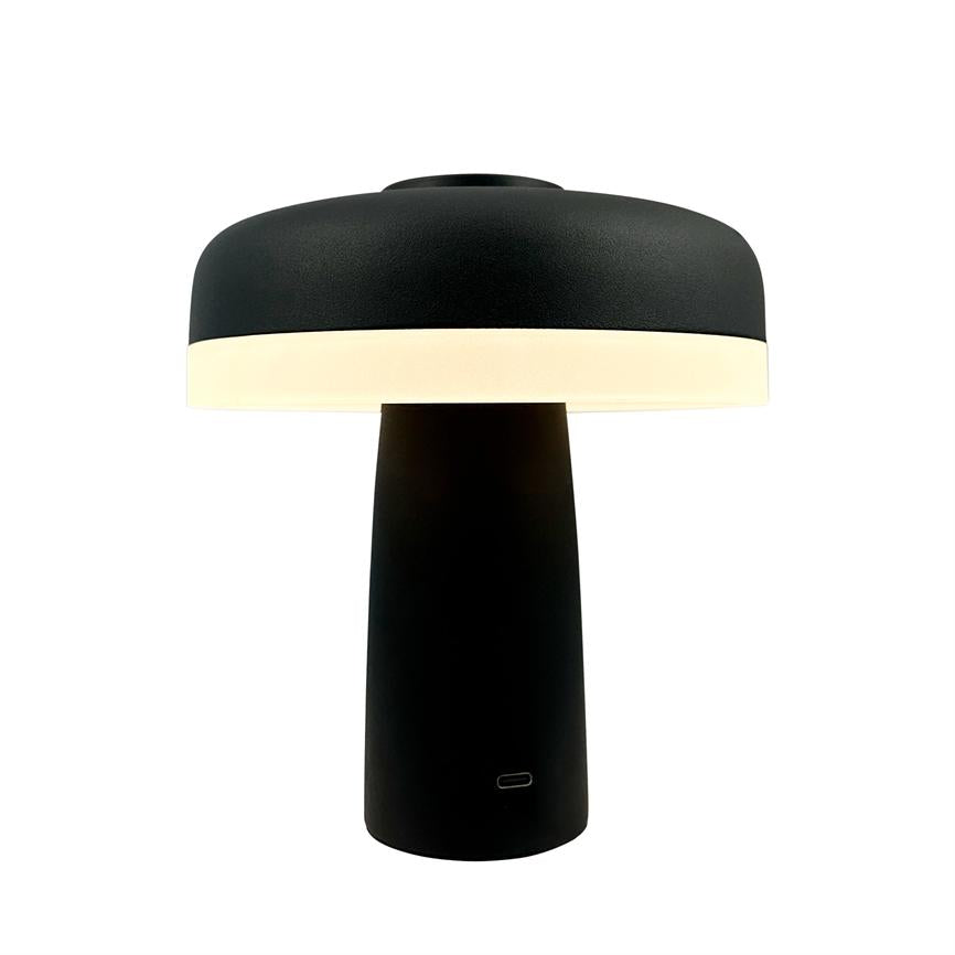Table lamp with black, mushroom-like shade and cylindrical base; the bottom edge of the screen emits soft, warm light, and a small USB-C port is seen in the front of the foot; neutral white background.