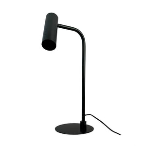 Black desk lamp with cylindrical shade, pointing downwards on a thin curved rod; stands on a round foot, cable lies next to it; isolated on white background.