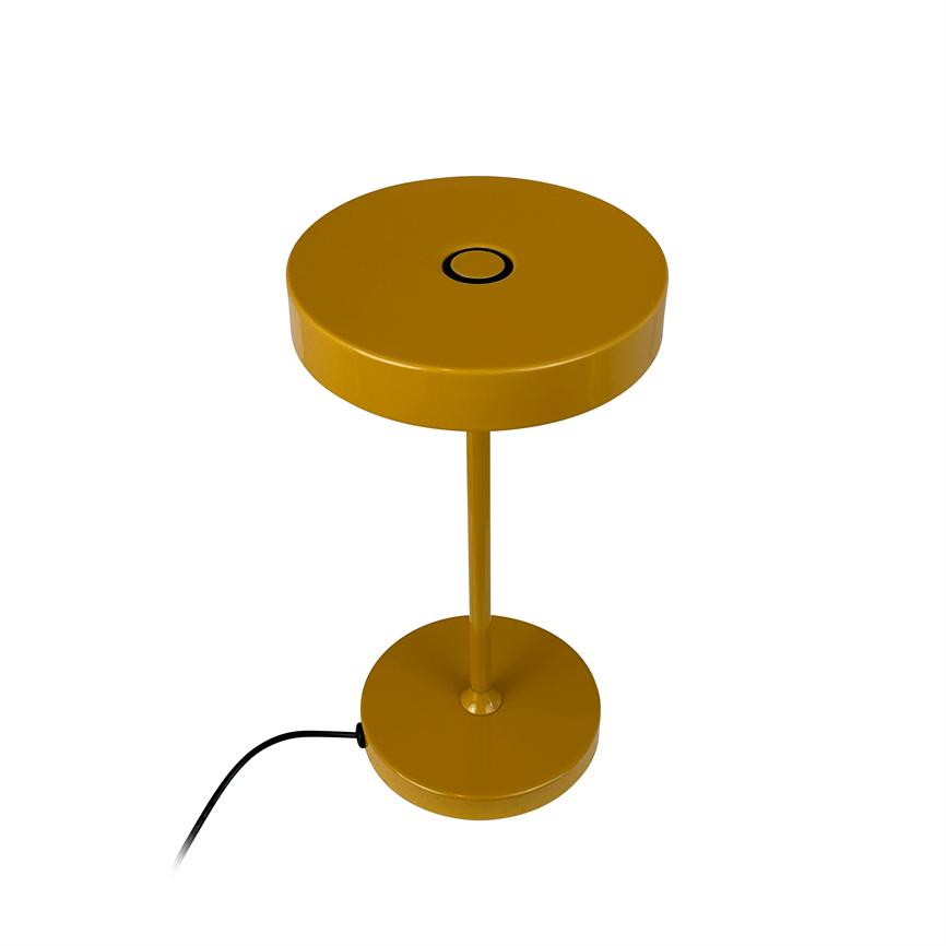 Table lamp with round, disc-shaped top; a thin central bar connects it to a round base, black power cable runs from the base. The object is isolated on a white background.