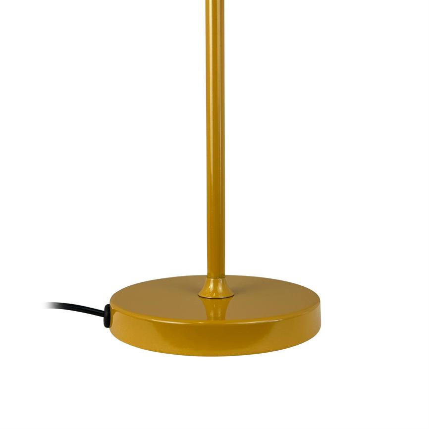 The round, yellow base of the lamp holds a slim, vertical stand; a black wire runs out to the left on a white background.