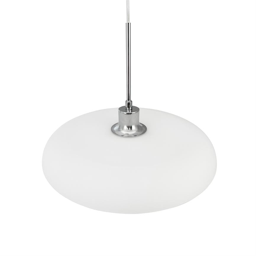 A round, flat, opal white pendant lamp hangs from a thin textile cord and chrome rod; chrome socket connects the screen to the wire, against a neutral white background.