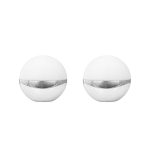 Two spherical containers, each with a matte white top and shiny silver band in the middle, stand side by side on a uniform white background.