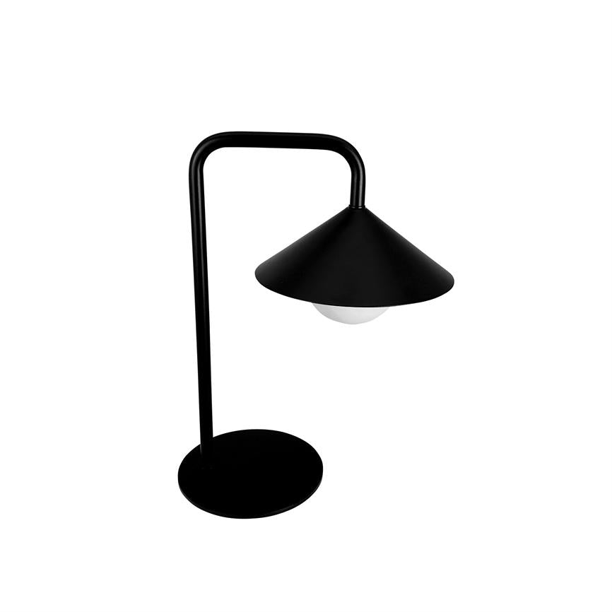 Black table lamp stands with a bent shaft, conical shade hangs down and covers a white bulb, placed on a round base against a white background.